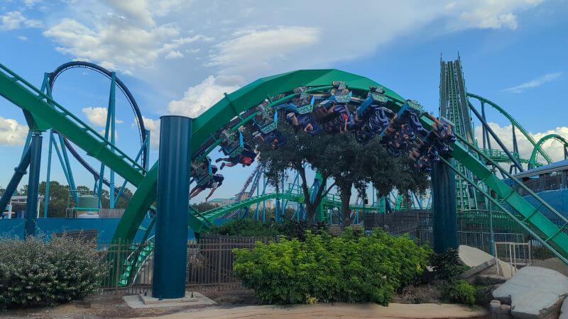 A floorless car of riders upside down in one of Kraken's 7 inversions