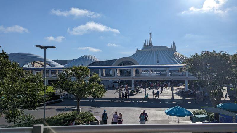 Looking out over Tomorrowland towards Space Mountain's iconic white dome from the Tomorrowland People Mover