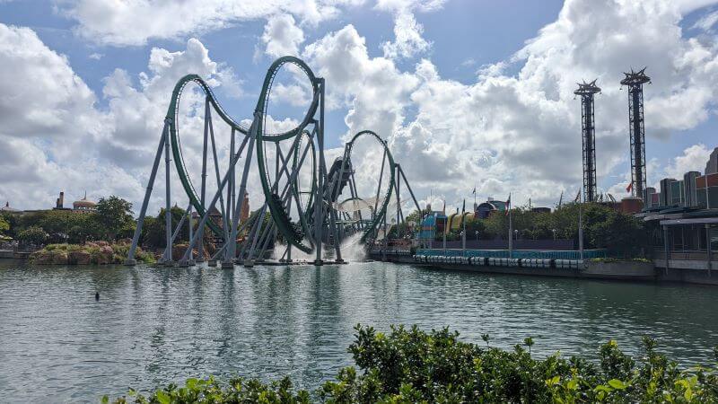 Looking towards The Hulk as a train is thrust around the first 3 inversions over the lake