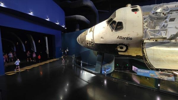 Visitors entering The Shittle exhibit at the nose section of Atlantis