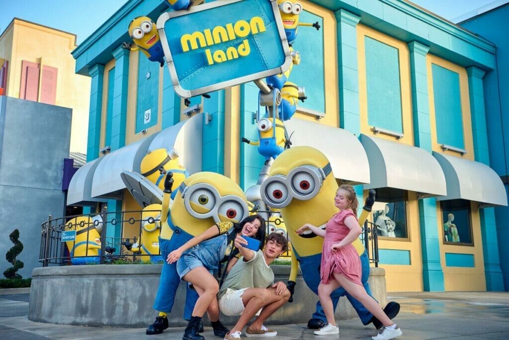 Guests getting a photo with some Minions at the new entrance to Minion Land at Universal Studios Florida