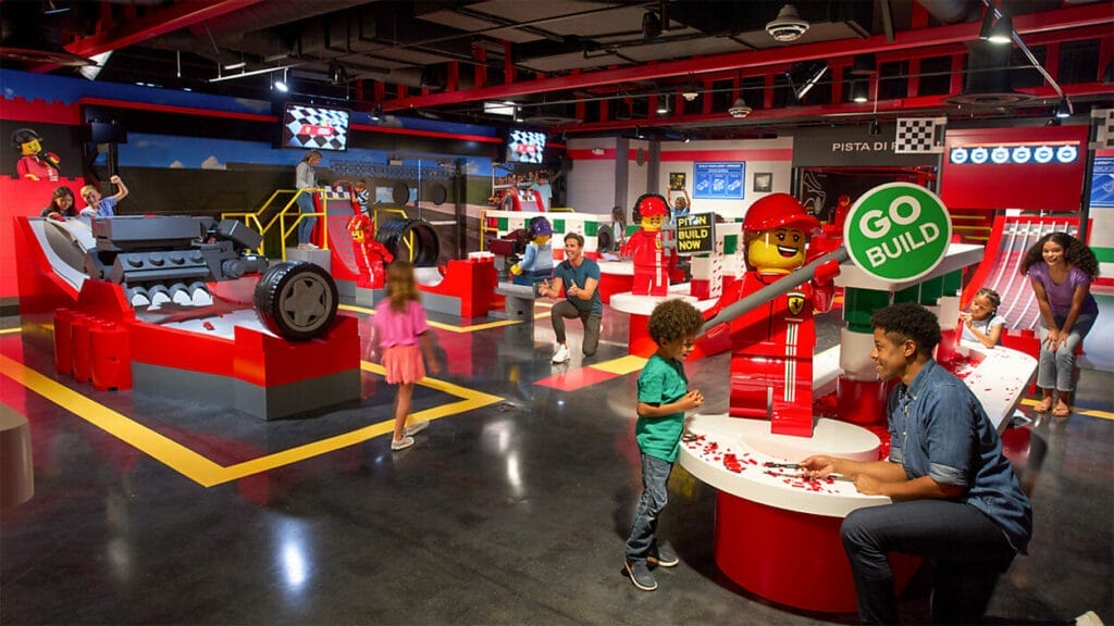 A peek inside the new Ferrari Build & Race attraction with familes enjoying the exhibits