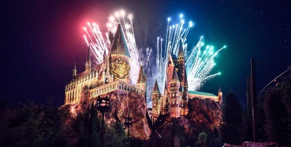 Fireworks exploding above Hogwarts Castle.