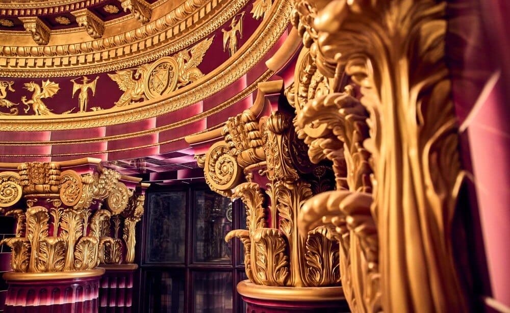 Inside Delores Umbridge's Office painted a deep pink colour with plenty of gold trims