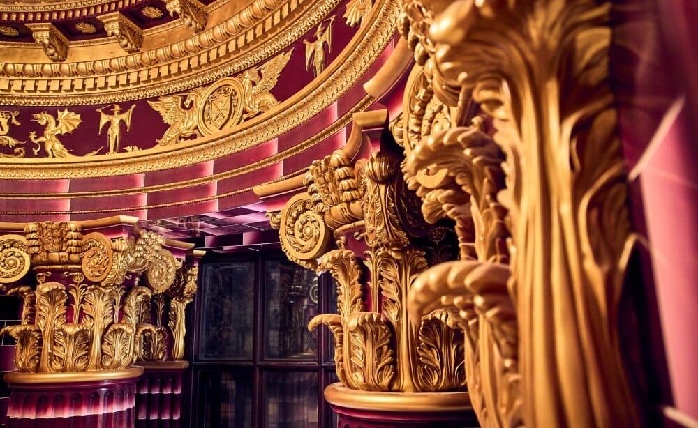 Inside Delores Umbridge's Office painted a deep pink colour with plenty of gold trims