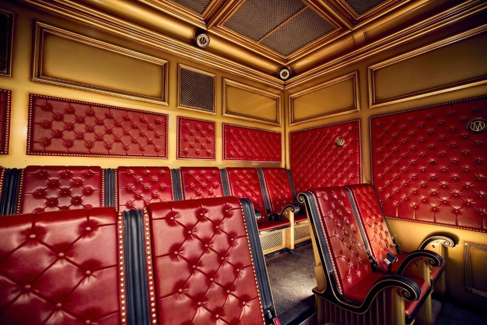 Looking at the seating arrangement it he new ride vehicles with plush red leather seats.