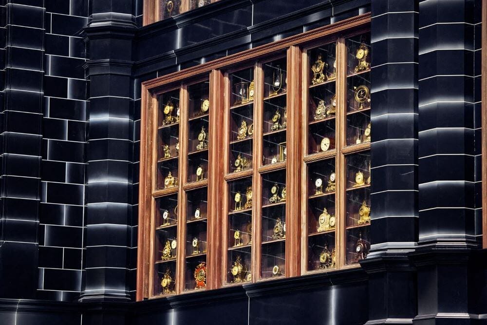 Looking at a cabinet storing lots of Time-Turners on a wall in the Time Room.