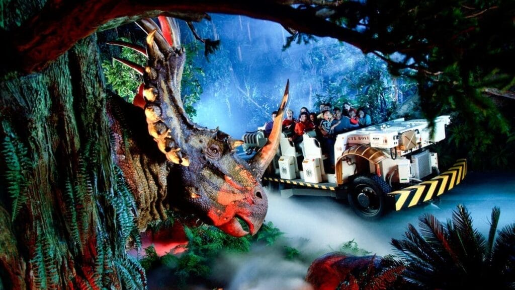 Guests enjoying a ride in a time traveller buggy through a scene involving a Hadrosaur