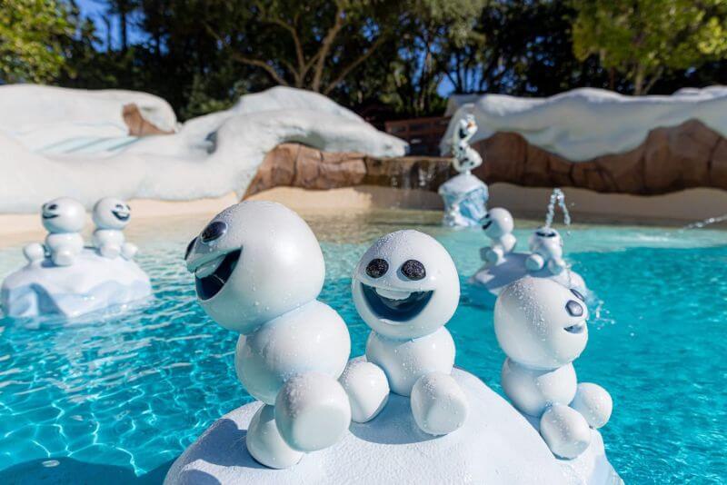 Playful snowmen in the kiddie pool in Blizzard Beach on a sunny day